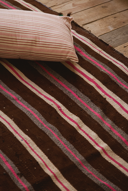 Brown and pink striped rug