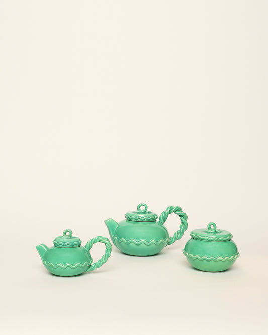 <tc>Green ceramic tea set</tc>