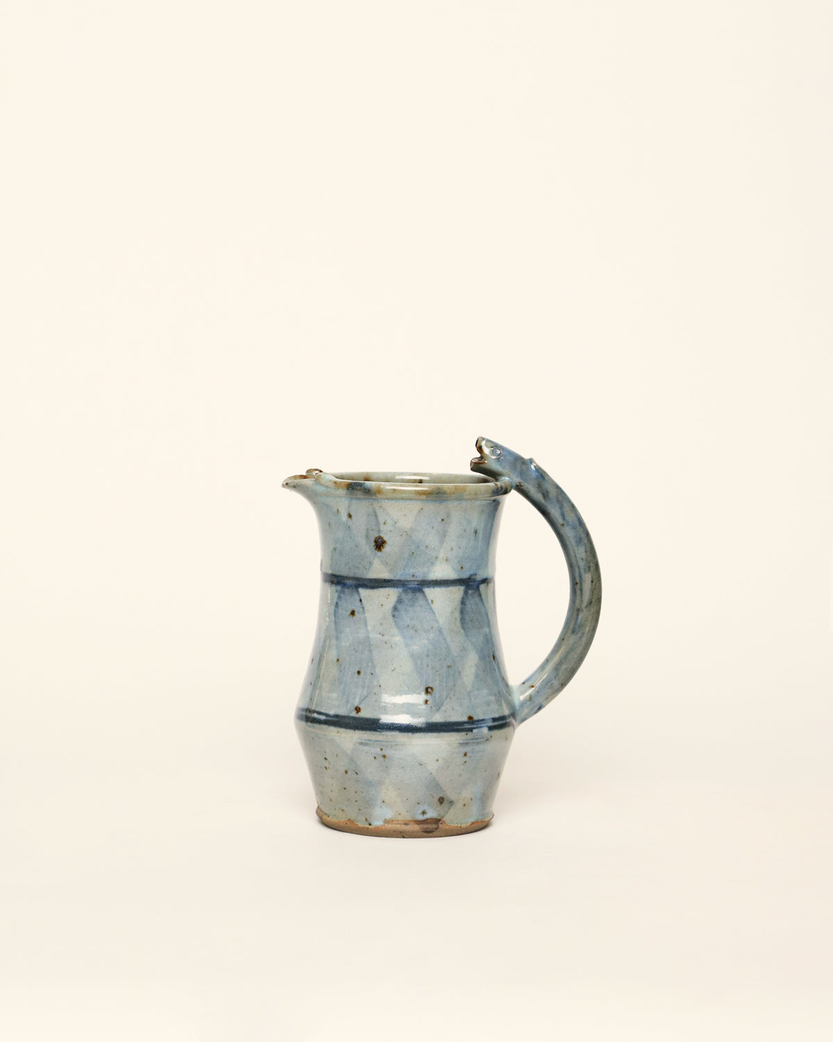 <tc>Blue jug with fish handle</tc>